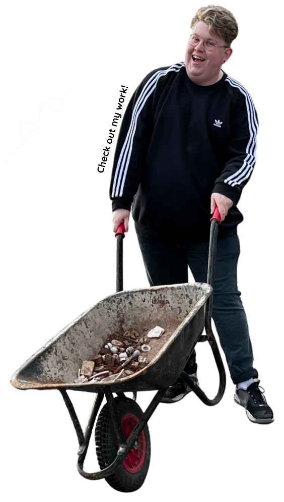 Alt text: A transparent png image of Haley, a non-binary artist, holding a wheelbarrow. Haley is standing in front of a plain light green background, and is wearing casual clothes and a wide smile. In the image, Haley is holding a green wheelbarrow with both hands, and to the left of Haley's right arm, there is a small banner that reads "Check out my work!" in bold letters.